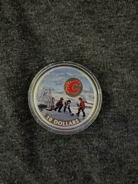 Calgary Flames Collectible Pure .999 Silver $10 Coin - Winter Hockey Scene